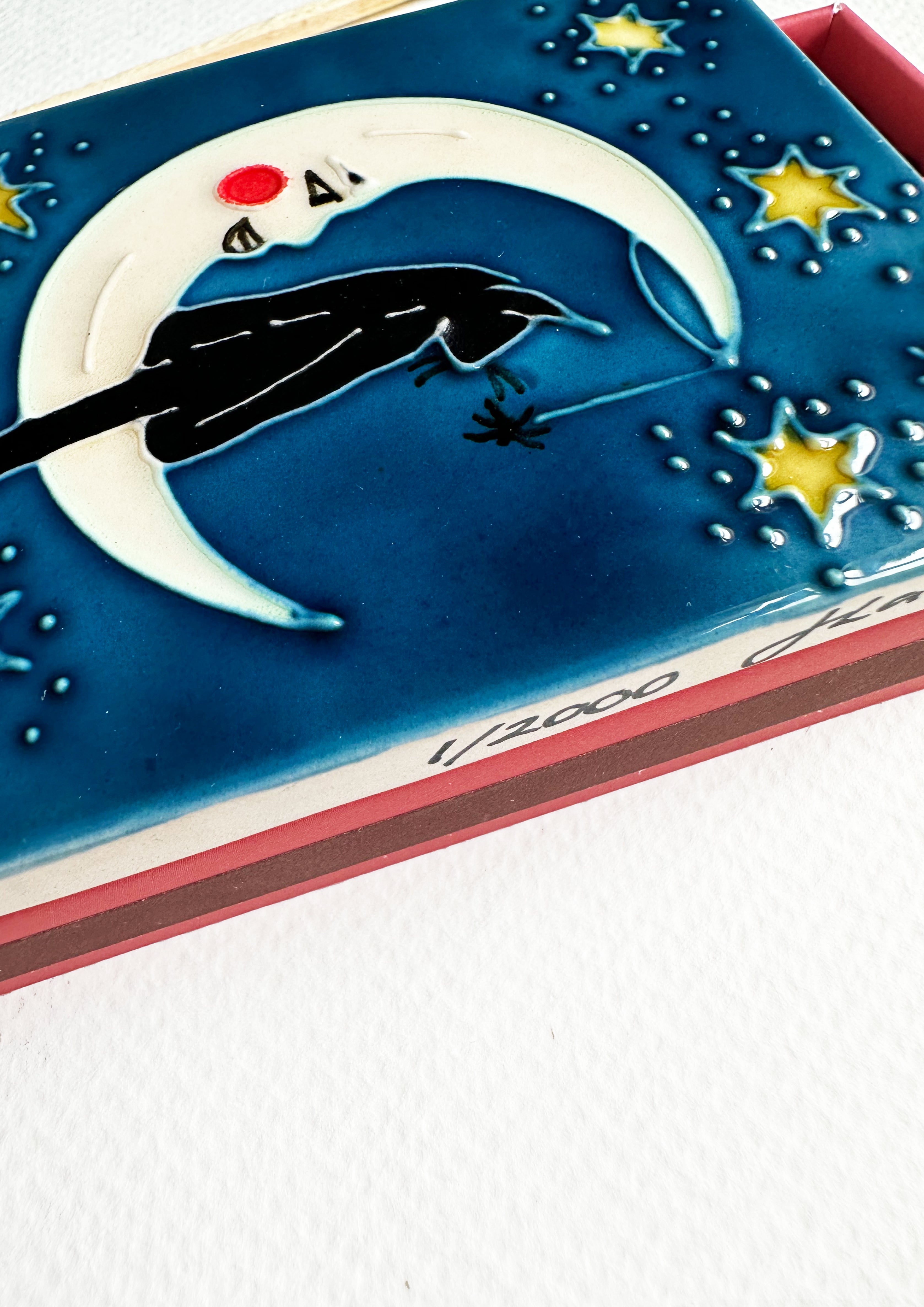 Luxury ceramic matchbox featuring The Magician Tarot card - a black cat sits within a crescent moon. The ceramic artwork sits atop a luxury card case with striker strip. Each box contains 40 navy coloured extra long safety matches.