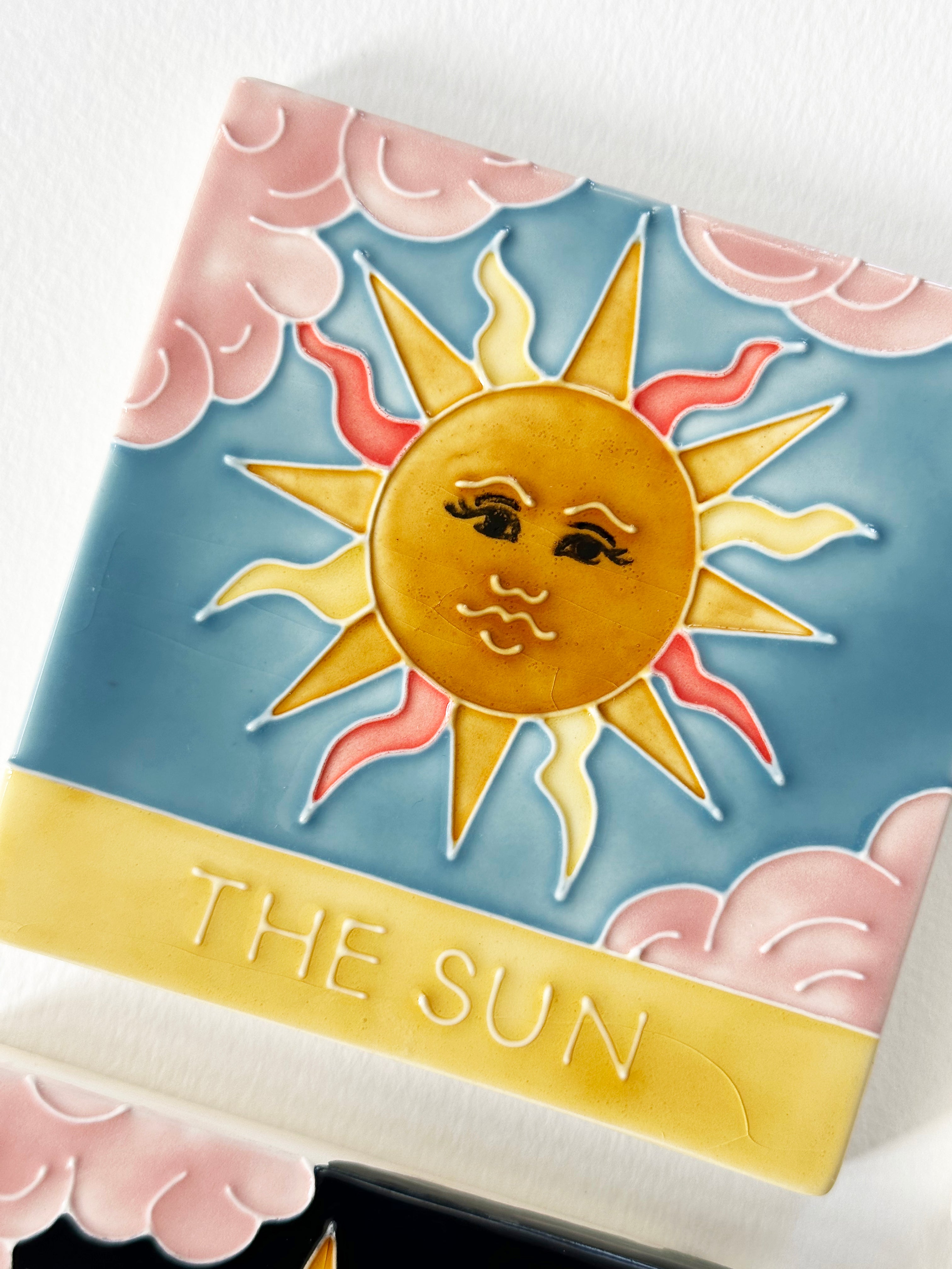 Beautiful hand painted ceramic tarot coaster set. Featuring tarot cards The Moon, The Sun, The Star, The World. Made by hand in Staffordshire, England. CC Jo Laing.